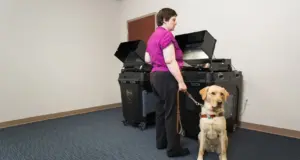 Person with service dog using election AT